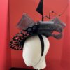 "Vondee" Black Guipure Lace Saucer Hatinator with Acrylic base.