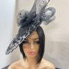 "Vondee" Black Guipure Lace Saucer Hatinator with Acrylic base.