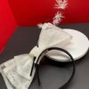 Sandy - White Sinamay Double Bow Fascinator: Black Quills, Modern Derby Headpiece.