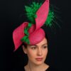 Zylah Bloom - Hot Pink Lily Fascinator: Green Feather Statement Hat - ByAlpha Couture.